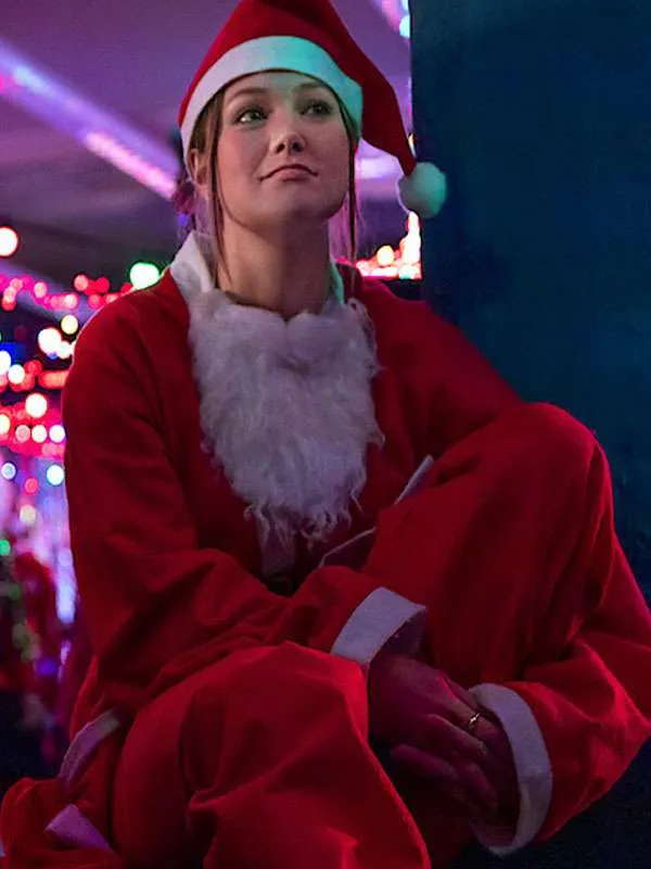 Jingle-Bell-Heist-2025-Olivia-Holt-Mrs-Santa-Red-Velvet-Coat.webp